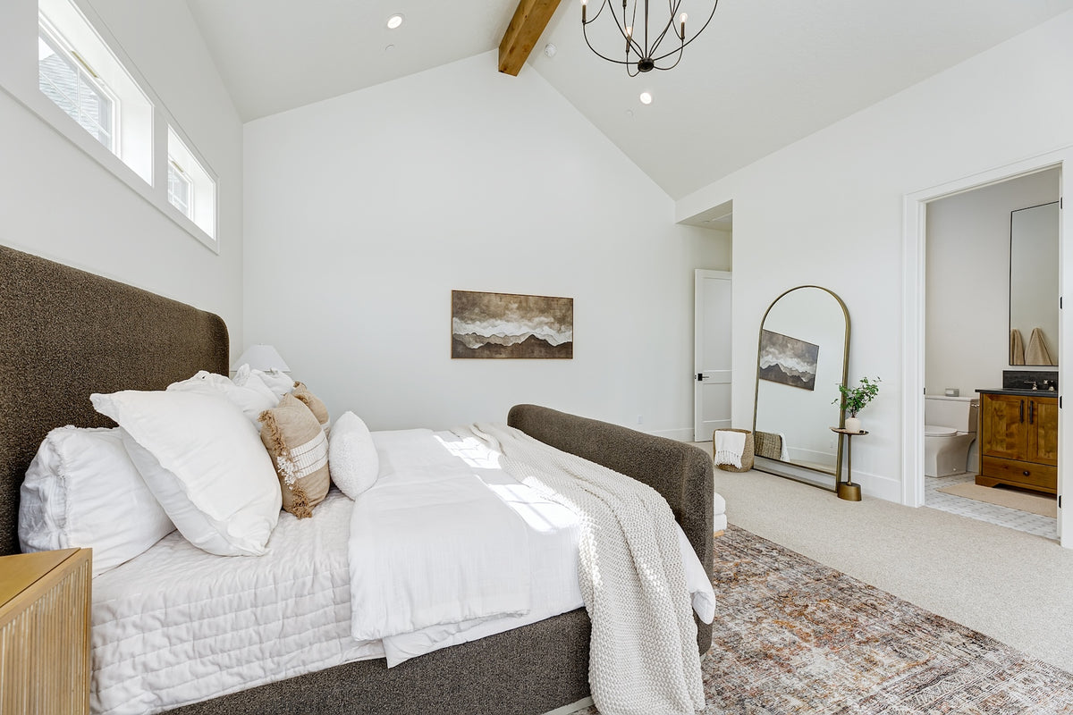 Highland Homes- Parade of Homes -  en suite guest room with vaulted ceiling beam in Eagle, ID. 