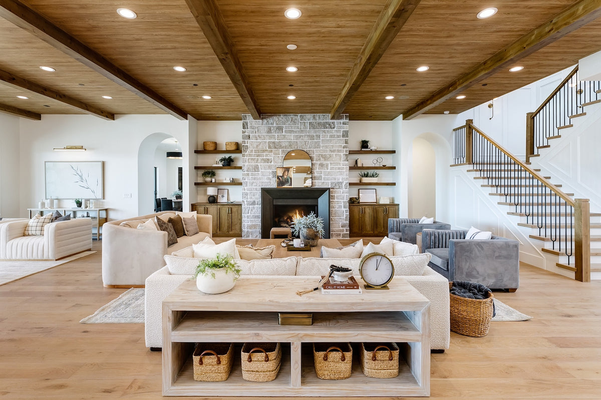 Highland Homes- Parade of Homes -  great room with stone fireplace, white oak floors, and custom iron staircase in Eagle, ID. 