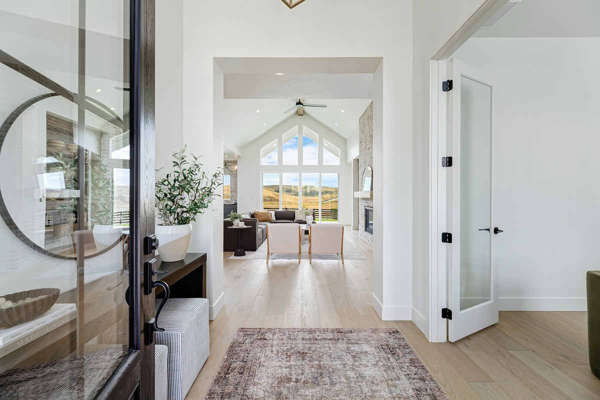 Highland Homes entry into vaulted great room and home office in Valnova, Eagle, ID