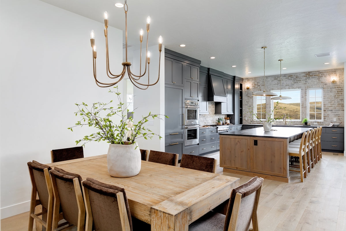 Highland Homes oversized kitchen and dining room with brick feature wall in Valnova, Eagle, ID