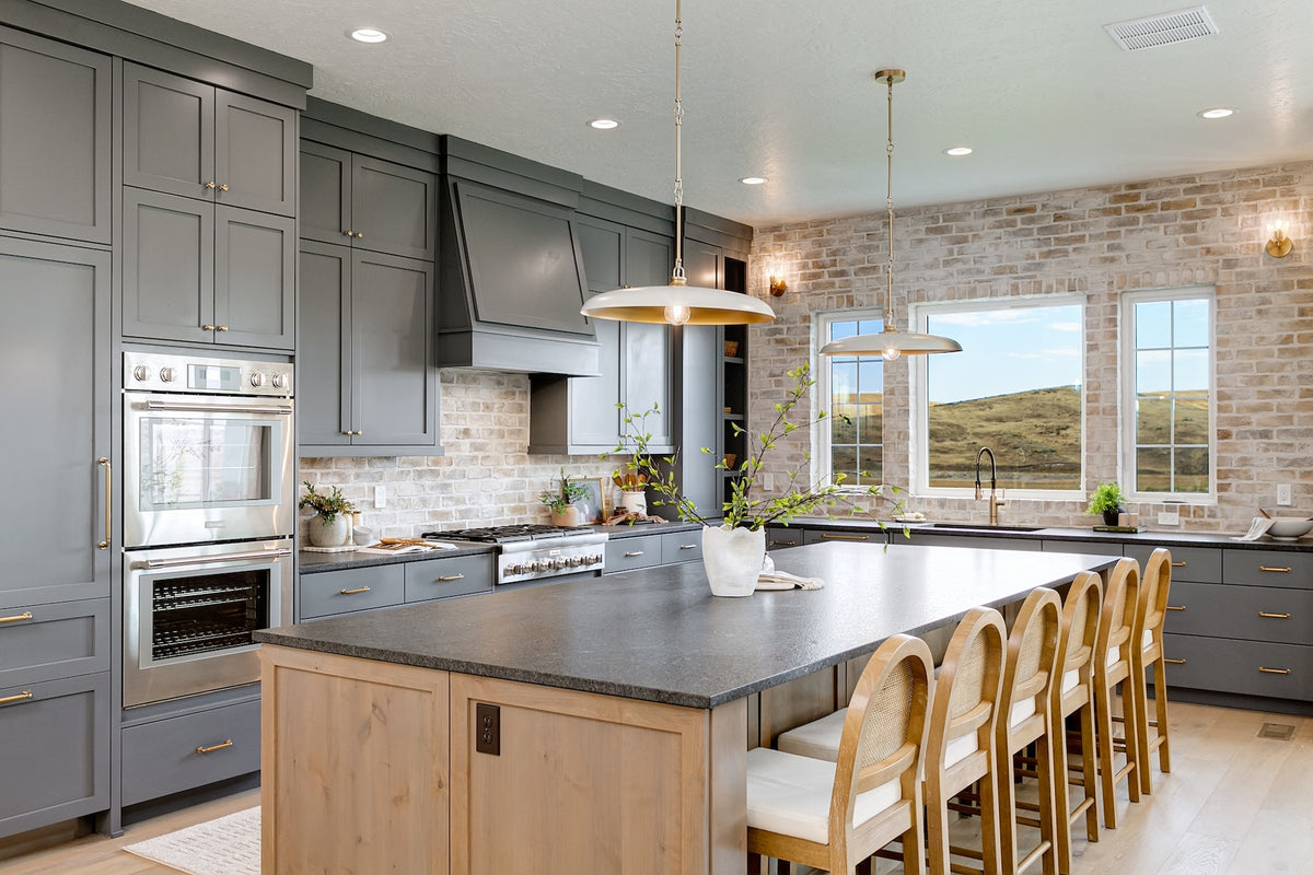 Highland Homes luxury home with oversized kitchen island and light pendants in Valnova, Eagle,  ID