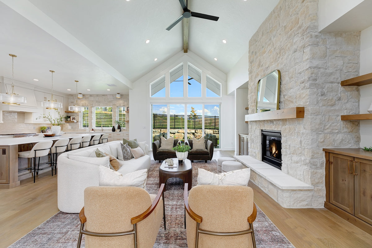 Highland Homes stone fireplace and vaulted great room in Valnova, Eagle, ID