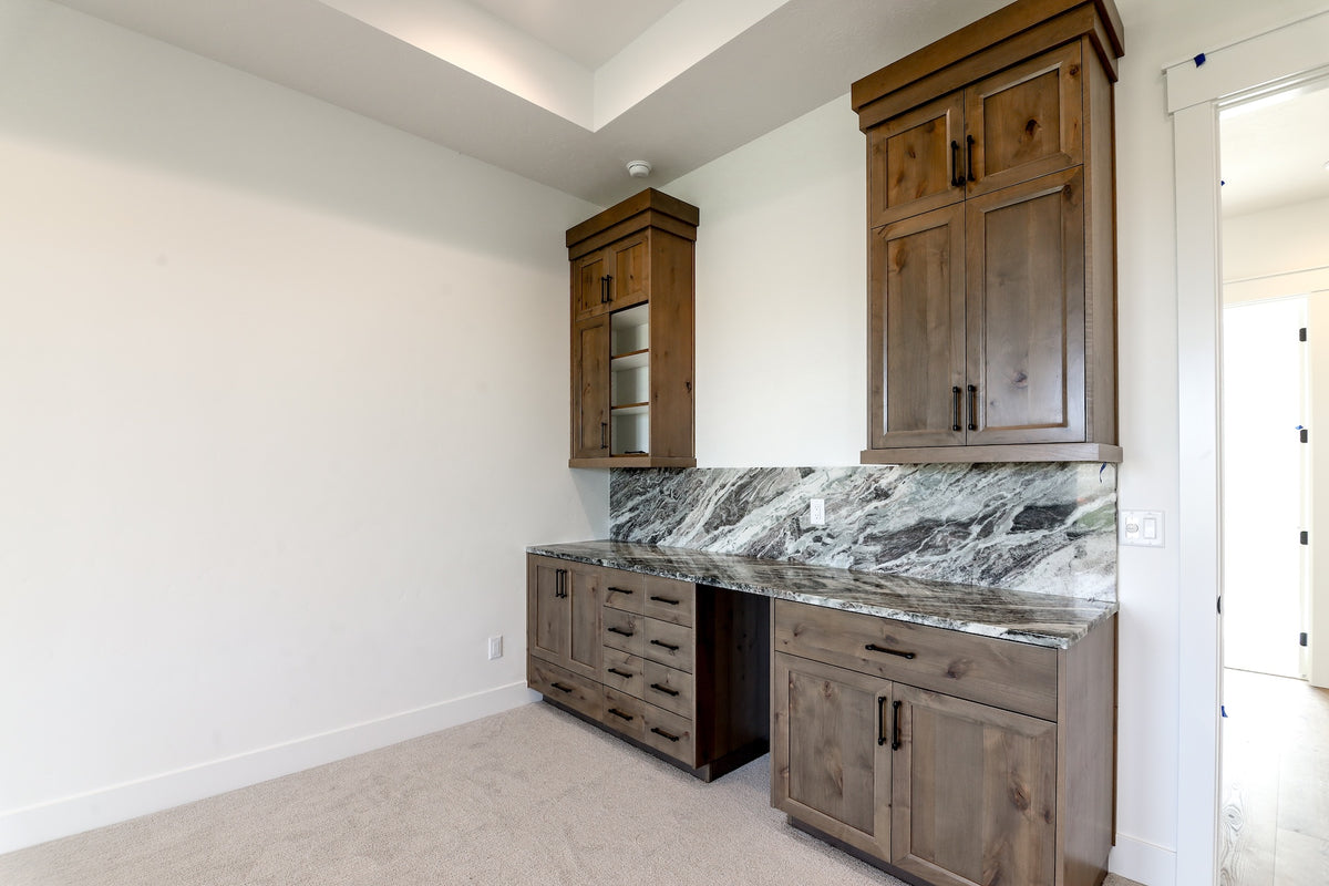 Modern kitchen with wooden cabinets and marble countertop